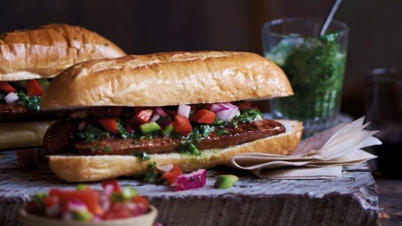 Street snack: Choripan - chorizo and chimichurri sandwich.