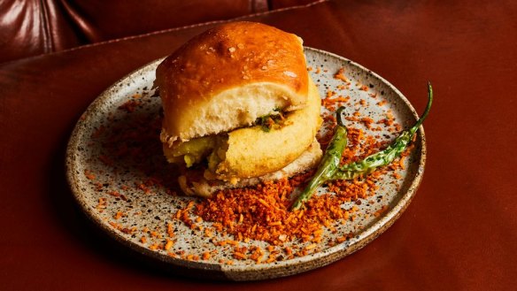 The vada pav, a milk bun with potato fritter and coriander chutney.