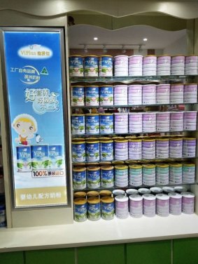 ViPlus infant formula products on display in a Chinese pharmacy.