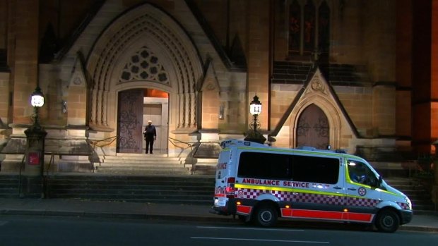 An ambulance waits outside St Mary's Cathedral to take the bell-ringer to hospital.
