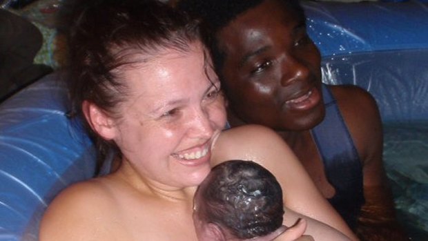 Kelly Boateng, with her husband and baby, after she gave birth in water.