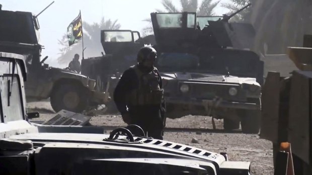 Iraqi Security forces, supported by US-led coalition airstrikes, advance their position in Ramadi.