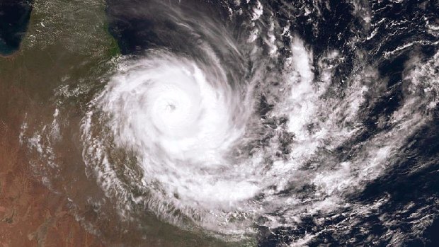 A satellite image of Cyclone Debbie as it hits the coast of Queensland.