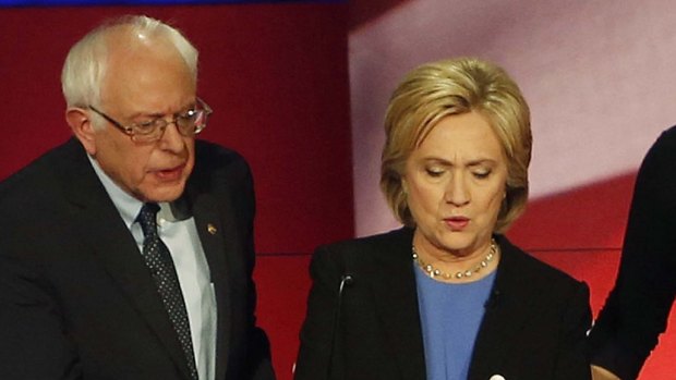 Not only clashing: Hillary Clinton and Senator Bernie Sanders confer during a break.
