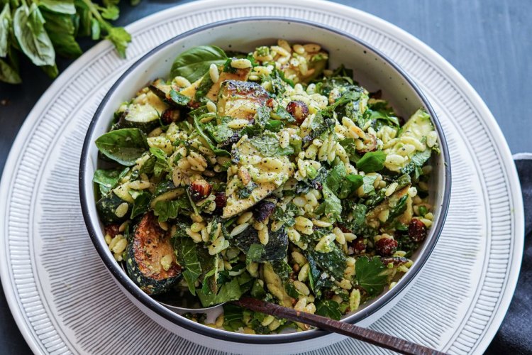 Charred zucchini, risoni and herb pasta salad with parmesan and pea dressing.