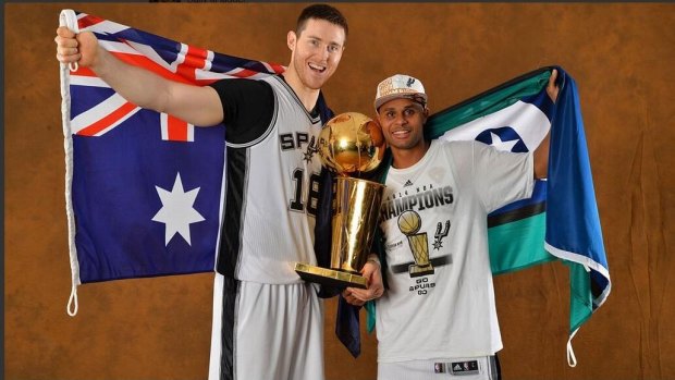 Proud moment: Australia's NBA championship winners, Aaron Baynes and Patty Mills, with the Larry O'Brien Championship Trophy.