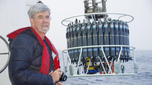 Church on the CSIRO research voyage in May. The instruments behind him collect water samples and other information.