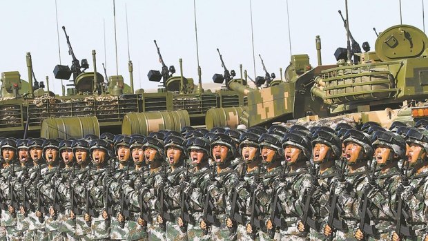 The People's Liberation Army parade at the Zhurihe military training base in China's Inner Mongolia region to mark the 90th anniversary of their founding.