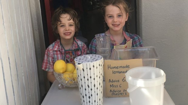 The author's children running their lemonade stand.