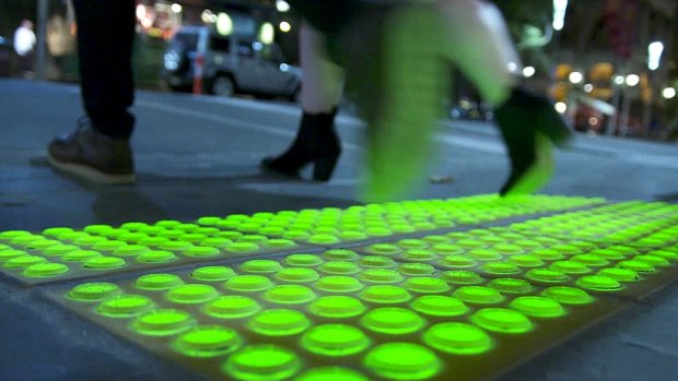 The new safety lights have been built into the footpath on the corner of Little Collins and Swanston streets.