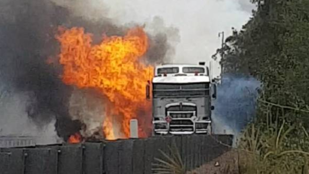 The three-truck crash caused a large explosion that started a bushfire at Cooranbong in Lake Macquarie. 