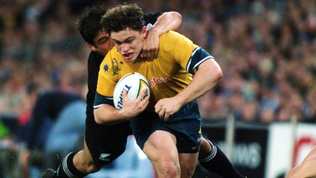 Action man: Wallaby utility Rod Kafer in the thick of the action against the All Blacks in 1999.