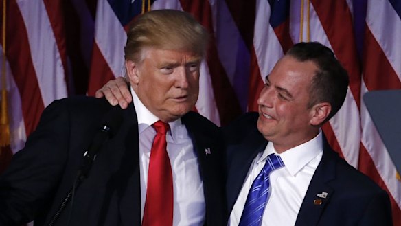 US President-elect Donald Trump, left, embraces Reince Priebus, chairman of the Republican National Committee.