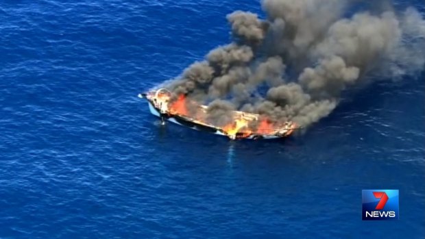 Channel 7 image of a boat on fire off the Gold Coast.