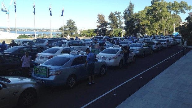 Taxis clog Parliament House in protest against the Uber service.