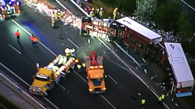Emergency crews work to clear a truck crash at North Lakes.