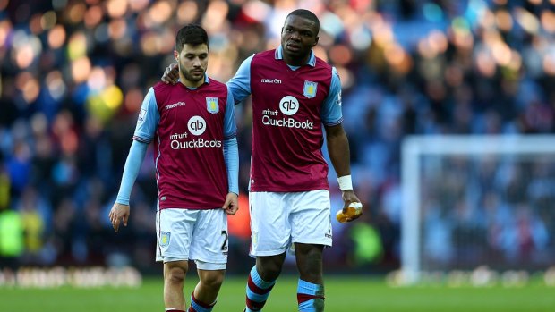 Won't play: Aston Villa defender Jores Okore (right) has refused to play for the relegated club.