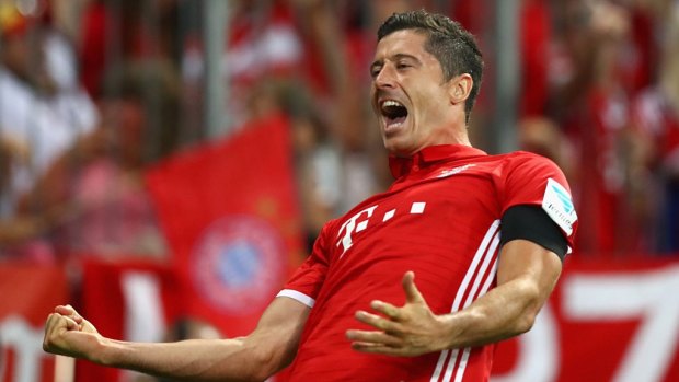 Flying start: Robert Lewandowski scored a hat-trick in Bayern Munich's opening Bundesliga match.