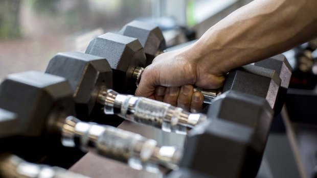 Weighing the benefits: A new study shows weight training is more beneficial for keeping your waistline in check than aerobic exercise.