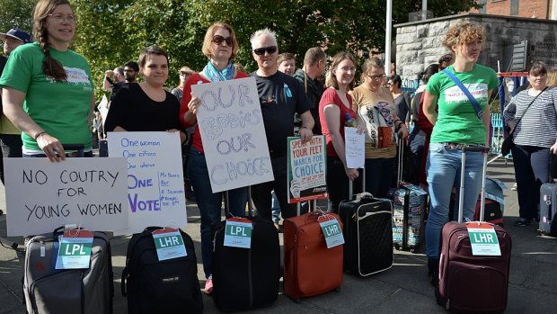 Pro-choice protesters bring luggage to symbolise the journeys many Irish woman are forced to make. 