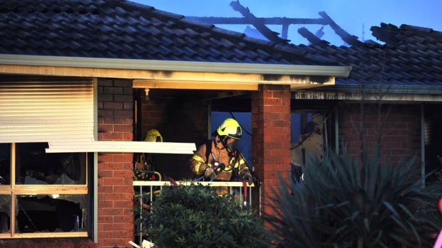 Firefighters go in to search the house at Topaz Court, Mulgrave.
