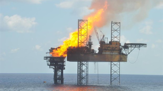 A handout photograph shows a well head platform on fire in the Montara oil field on  November 2, 2009. 