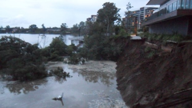 A chunk of land has washed into the Brisbane River at Ken Fletcher Park in Tennyson. 