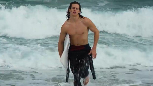 Nat Fyfe evokes Baywatch as he emerges from the surf.