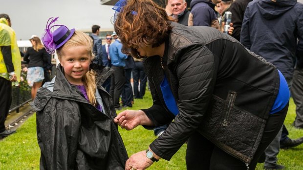 Ella Sibley,5, gets rugged up by Grandmother Rosemary Mann at last year's Cox Plate Day at Moonee Valley Racecourse.