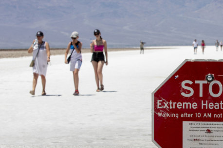 A sign warns tourists of extreme heat in California in July 2024.