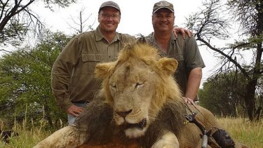 Hunter Walter James Palmer, left, with another lion he killed.