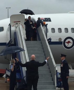 Sir Peter Cosgrove shunned an umbrella to welcome the Royals with open arms.