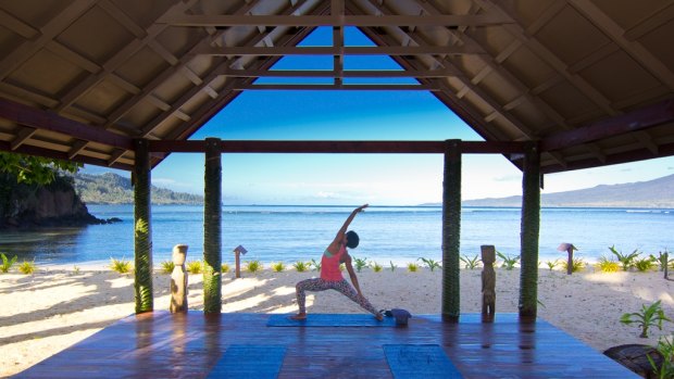 Yoga to start the day at Qamea Island Resort, Fiji.