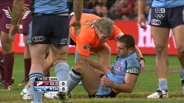 Bolt from the Blue: Robbie Farah is helped to his feet after a collision with Nate Myles' head in the 2012 series decider.