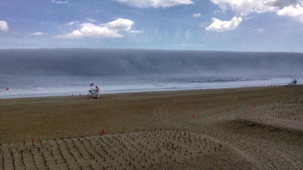 Tsunami look-alike: The fog wave rolled in to Sea Girt, New Jersey, on Sunday, stunning onlookers.