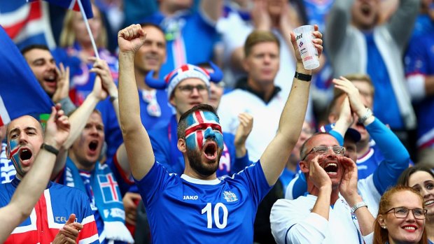 Loyal to the end: Iceland fans soak up the atmosphere, despite the result.