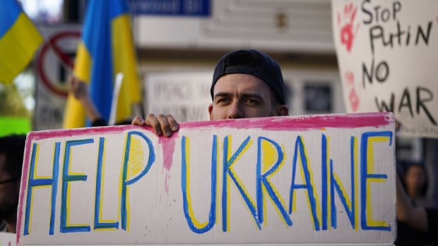 Dmytro Stasyshen, 27, of Ukraine, holds a sign to protest the Russian invasion of Ukraine during a rally in Los Angeles.
