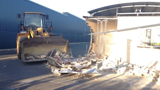 Two thieves used a front end loader to ram raid a Yangebup car wash.