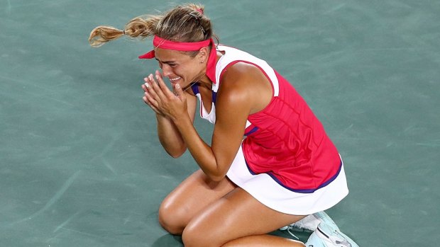 Shock win: Monica Puig of Puerto Rico reacts after defeating Angelique Kerber.