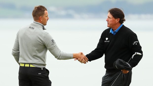 Prizefighters: Henrik Stenson and Phil Mickelson shake hands after their duel in the British Open.