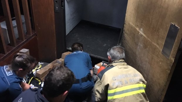 Man rescued after an elevator fell on him at Fortitude Valley.