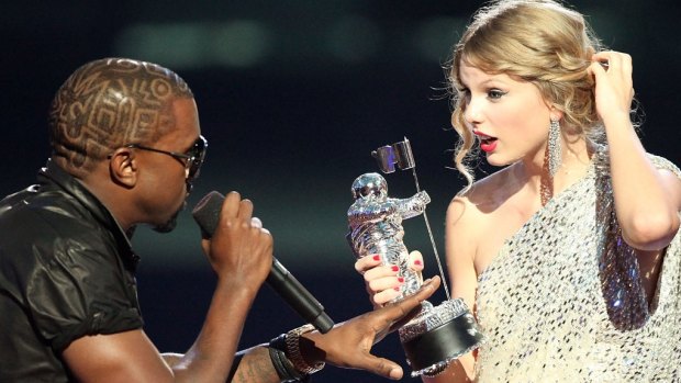 Kanye West takes the microphone from Taylor Swift as she accepted a VMA in 2009.