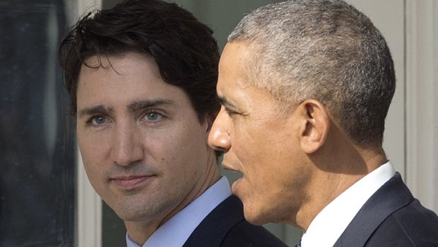 US President Barack Obama speaks with Canadian Prime Minister Justin Trudeau at the White House.