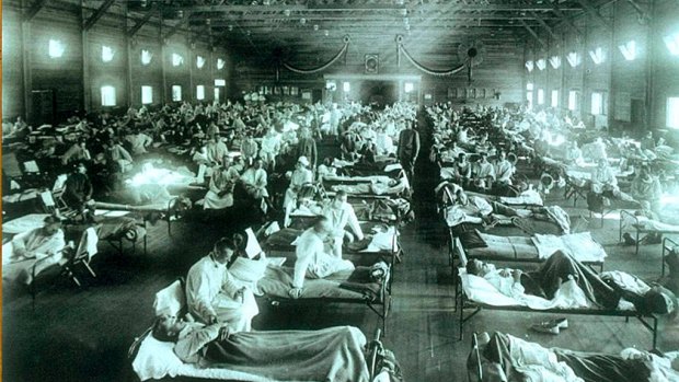 No sooner had World War I ended than a new enemy struck. Soldiers at Camp Funston in Kansas receiving treatment for Spanish 'flu in 1918.