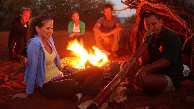 Shark Bay tourism operator Darren 'Capesy' Capewell tells a group that the sharks are of significance to the local Malgana people and deserve respect. 