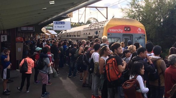 A crowd of people waiting for a train to arrive at Katoomba Station on a Sunday afternoon.