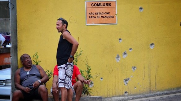 Bullet holes are seen on a wall in Rio's Complexo do Alemao favela.