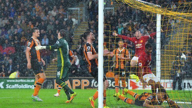 Late show: Marcus Rashford scores Manchester United's stoppage time winner against Hull City.