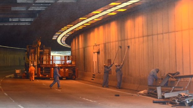 Cleaning in the Parkes Way tunnel to ensure no asbestos contamination.