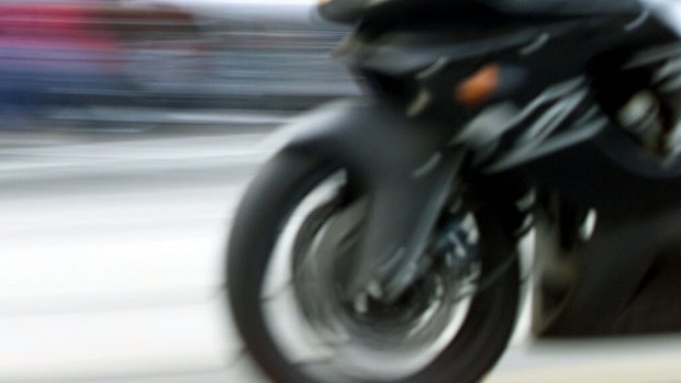 A motorbike rider allegedly crashed into a taxi while evading Cairns police.